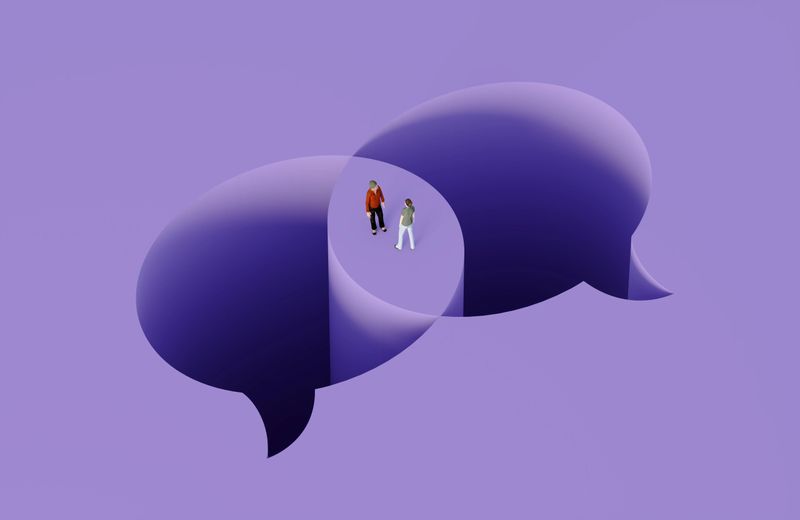 Cutout speech bubbles and a couple on purple background. Relationship concept.