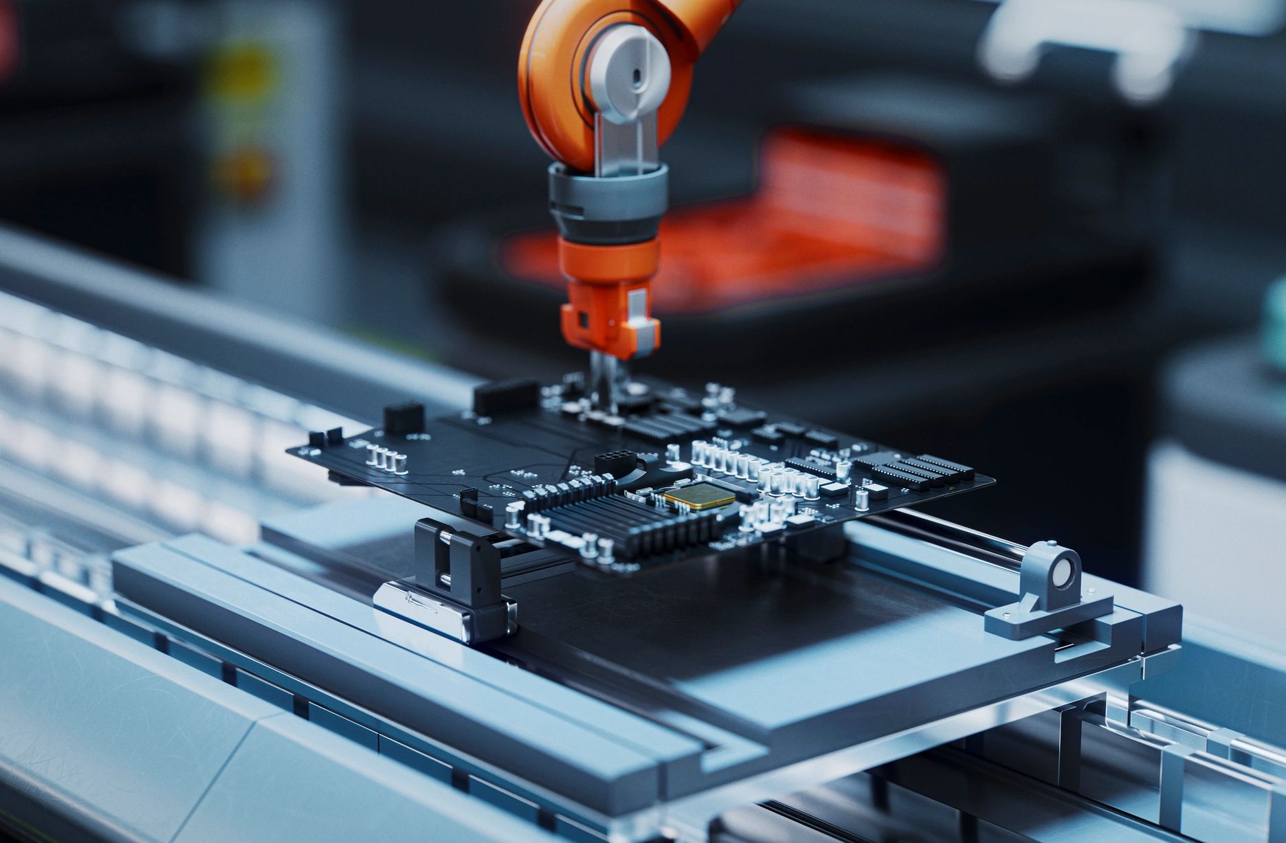 Robotic arm assembling a computer circuit board.