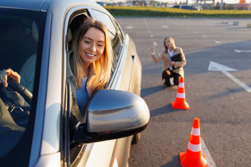 Learner Driver Engaged in Training as Instructor Guides Maneuver Steps