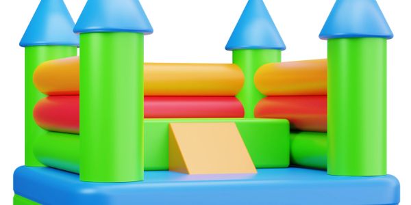 Colorful inflatable bounce house resembling a castle with blue turrets.