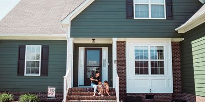 Inviting home entrance with vibrant door.