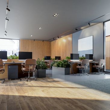 Modern office workspace with multiple desks and computers.