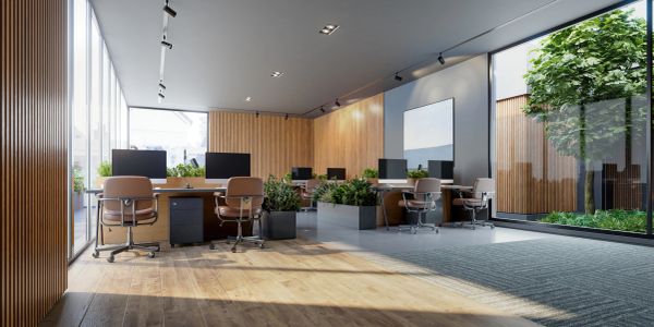 Modern office workspace with wooden accents and green plants.