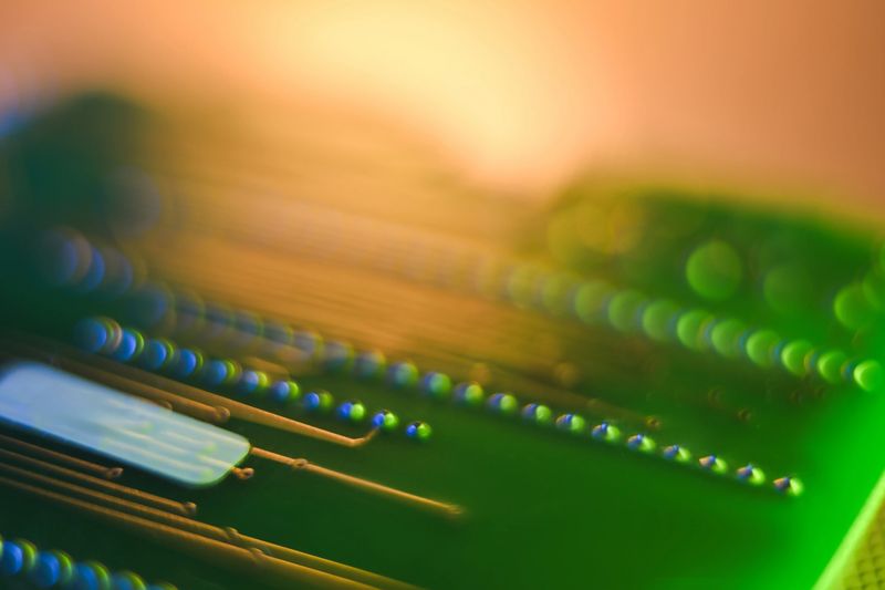 Circuit board detail showing abstract technology data and glowing light