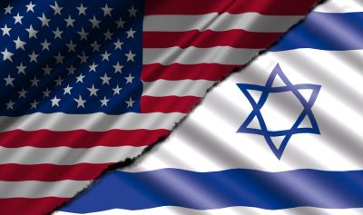 Torn flags of the United States and Israel side by side.