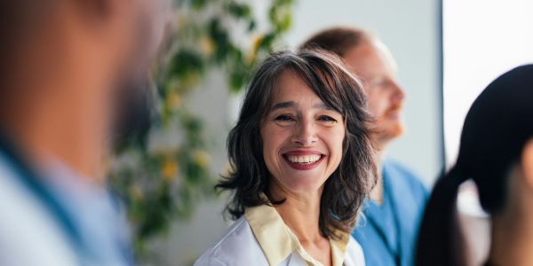 Smiling female doctor in a white coat.