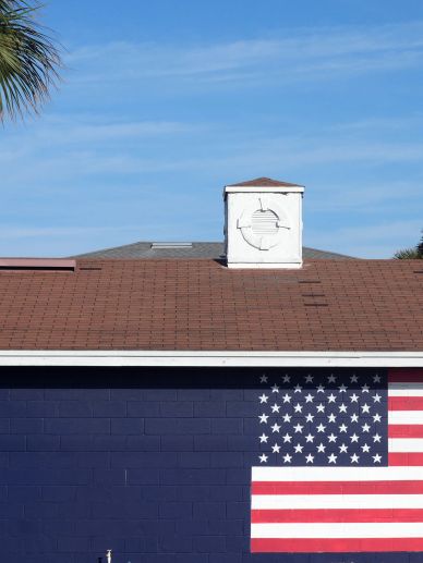 Post emblem with American flag.