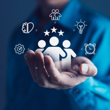 Hand holding icons representing teamwork, creativity, and time management.