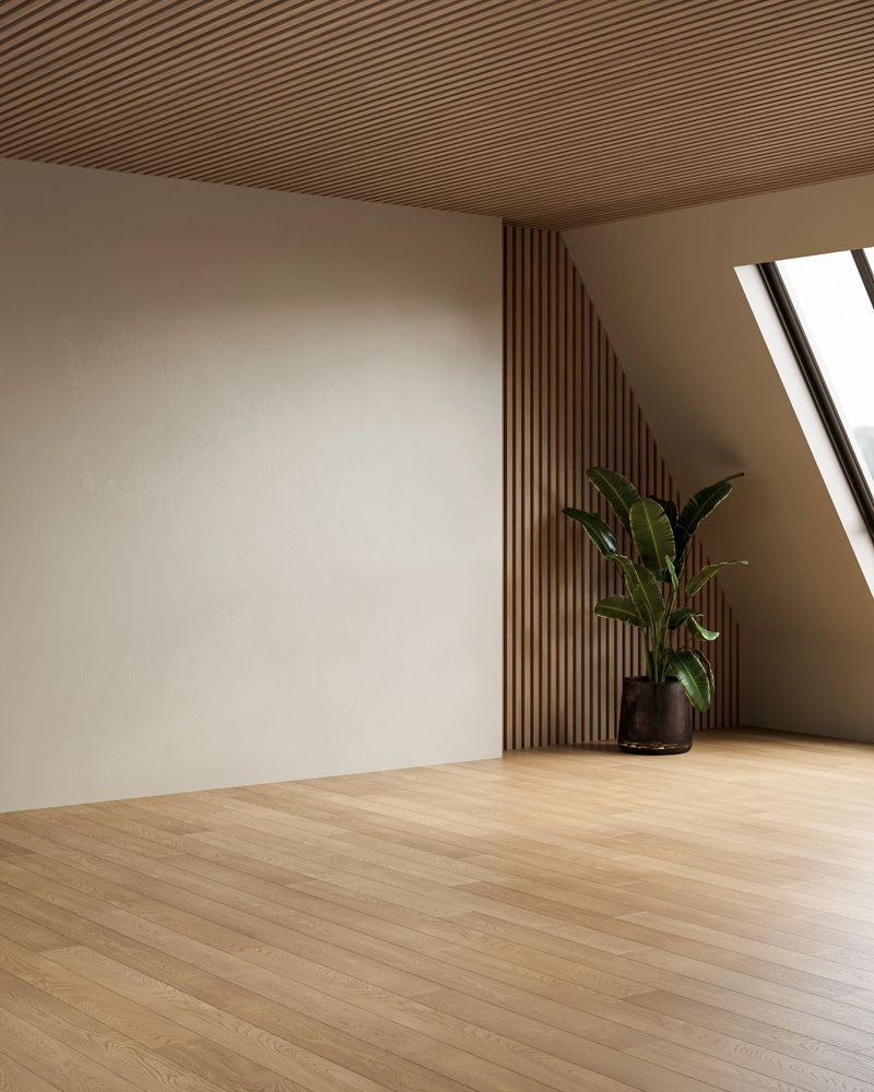 Minimalist empty room with wooden floor, neutral walls, indoor plants and natural skylight, perfect for design mockups and creative projects. 3D render.