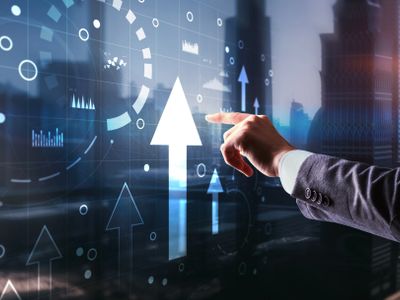 Hand pointing at digital arrows indicating growth and progress.