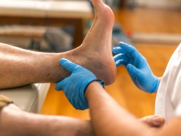 Doctor examining a patient's foot.