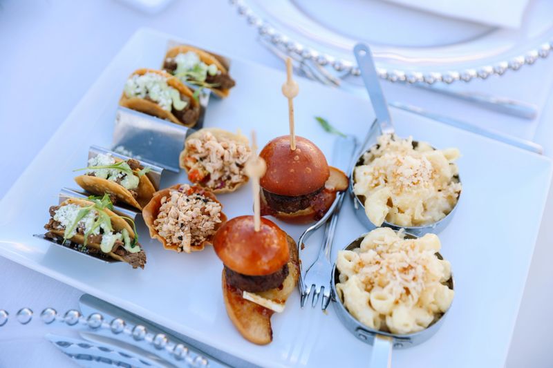 Amazing food served at a Wedding. Mini Tacos and Mini Burgers