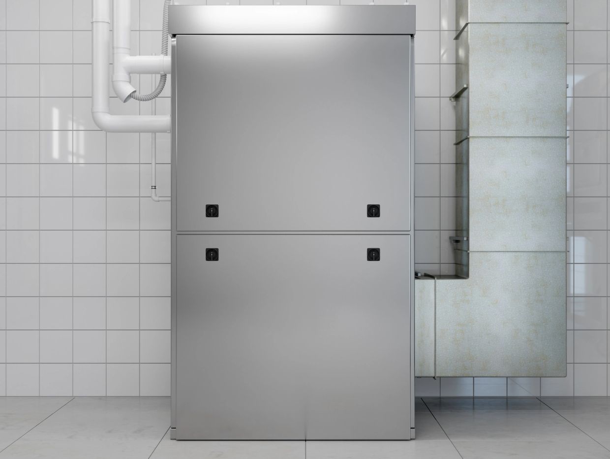 Industrial HVAC system unit in a tiled room.