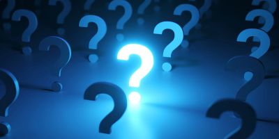 Glowing question marks on a blue background.