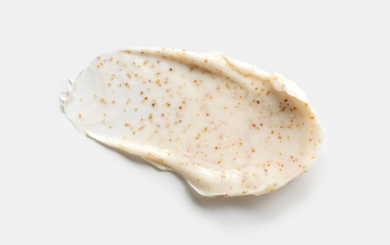 cosmetic smear scrub cream texture on a light background