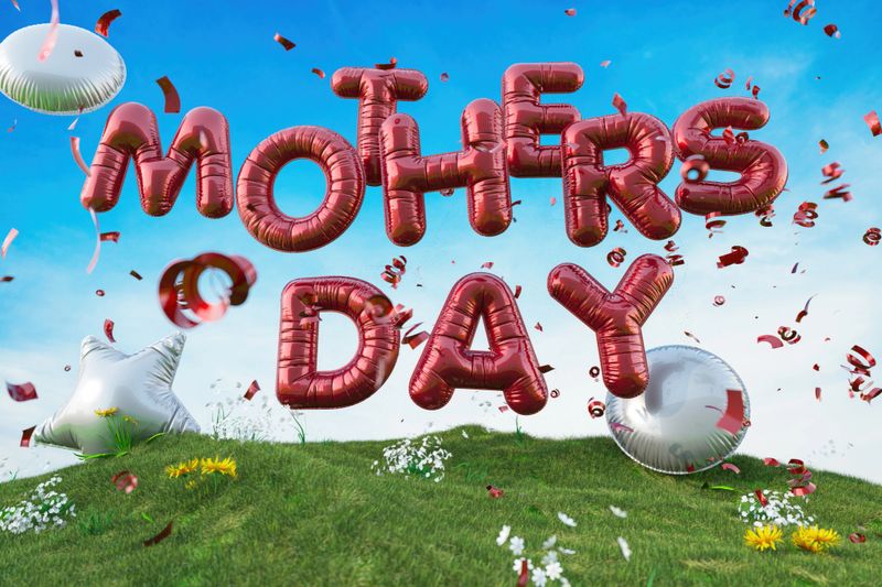 Happy Mother's Day Red Foil Balloon Text on Green Grass Field. 3D Render