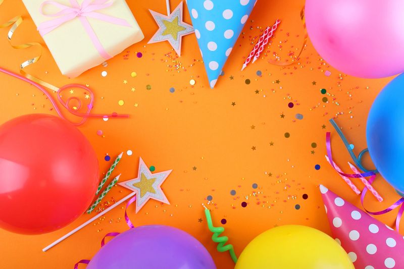 Colorful decorations create a joyful atmosphere for a vibrant birthday celebration with balloons and confetti