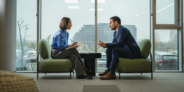 Man and woman having a professional meeting in an office.