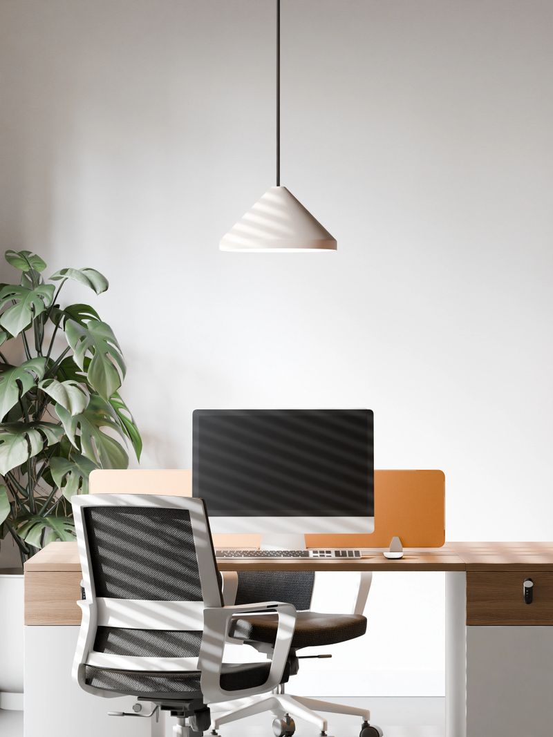 Modern Open Office Workspace with Minimalist Desk Setup and Natural Lighting features a clean and contemporary office interior with ergonomic chairs, shared desks, computers, and modern pendant lamps.