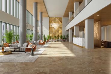 Modern hotel lobby with elegant furniture and natural lighting.