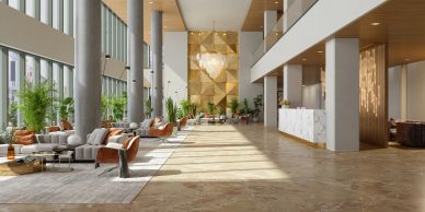 Spacious modern hotel lobby with natural light and elegant decor.