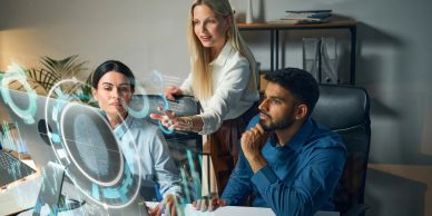 Team collaborating using futuristic holographic technology.