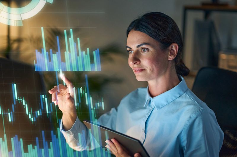 Professional Woman Engaged With Advanced Data Interface Displaying Interactive Digital Analytics Visuals In Modern Workspace. Ideal For Concepts Of Technology, Future, Business Intelligence.