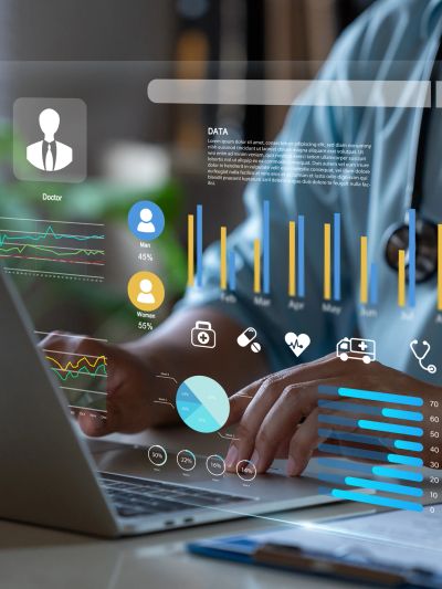 Doctor analyzing health data on a laptop with futuristic interface.