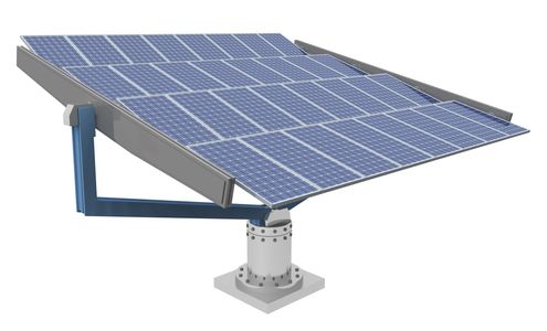 Solar panels installed in an open landscape with mountains in the background.