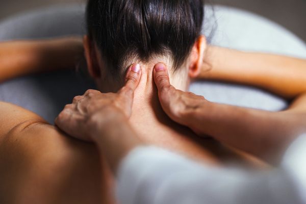 Person getting a neck massage.
