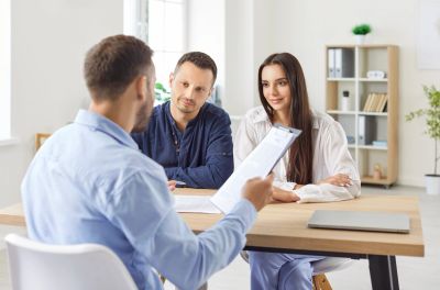 An advisor and client reviewing insurance coverage options together.