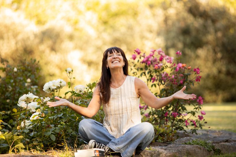 Portrait of a mature Latin American woman giving thanks for life and enjoying the afternoon outdoors - Buenos Aires - Argentina