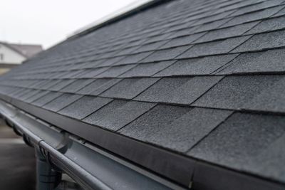 Close-up of a slate roof with gutters.