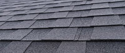 Close-up of a gray asphalt shingle roof.