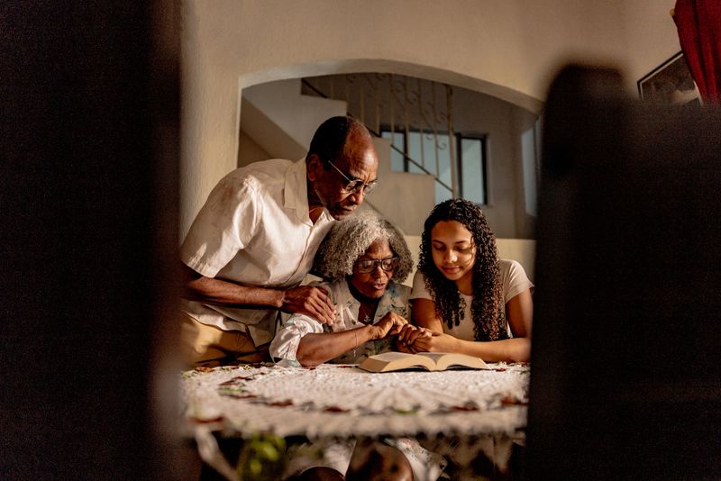 Family reading the bible at home