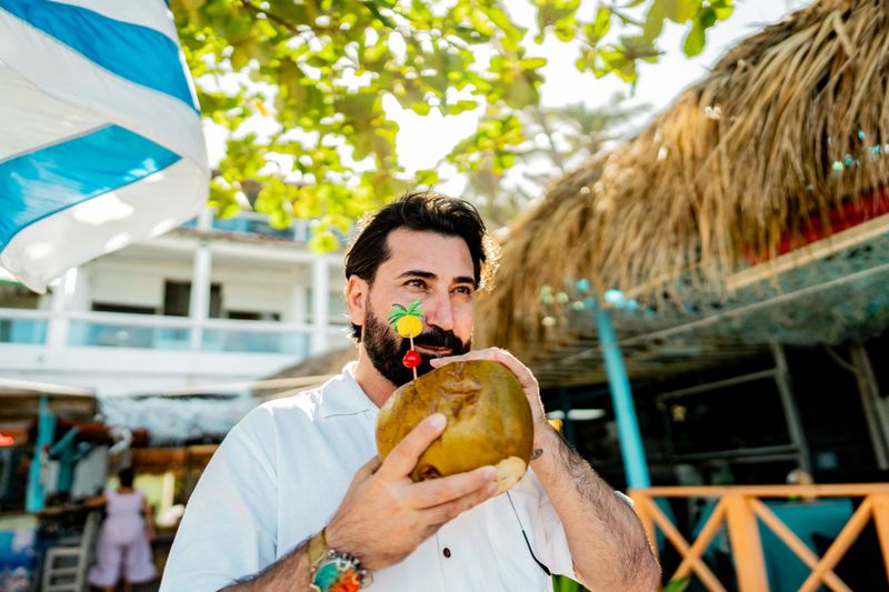 Mature tourist man looking way on tourist resort in Punta Cana, Dominican Republic