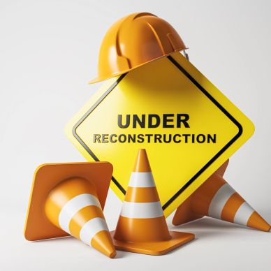 Construction safety gear with an under reconstruction sign.