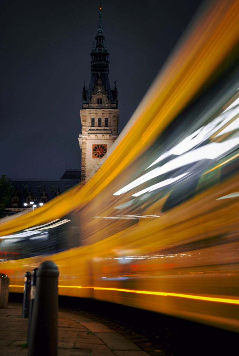 Long Exposure of Blurred Bus Passing Hamburg City Hall