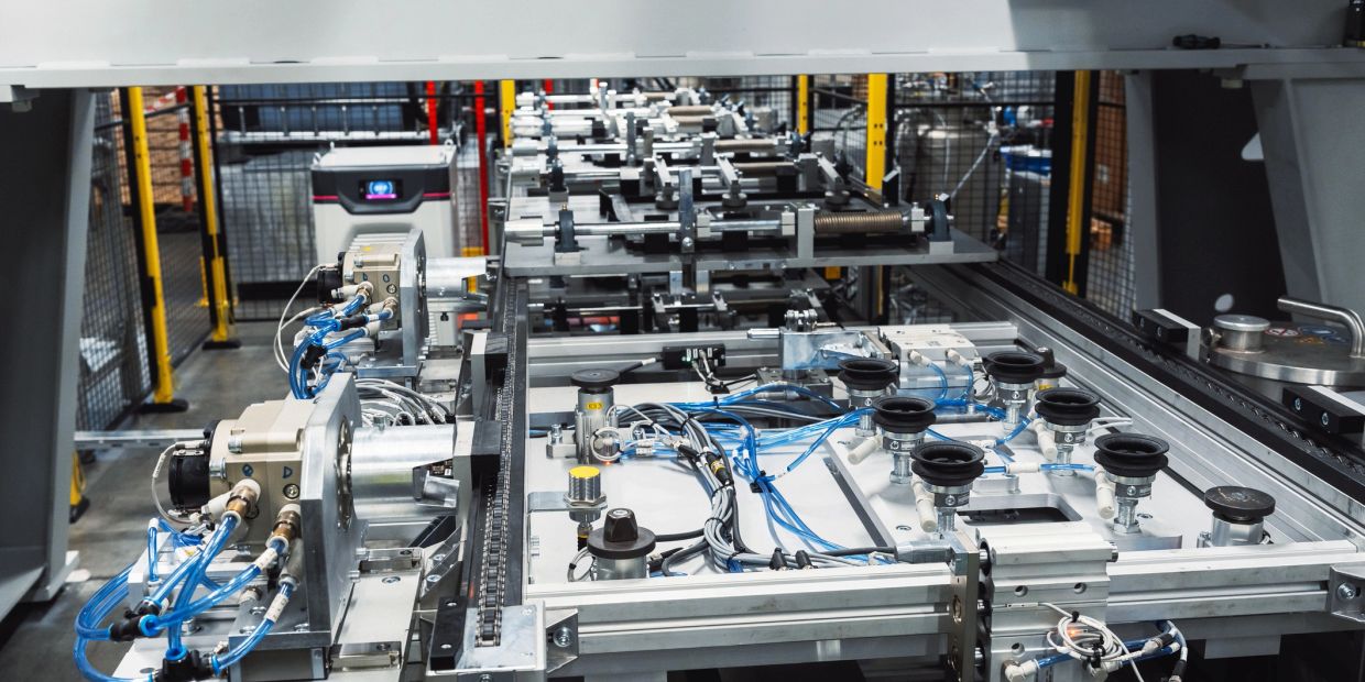 Industrial machinery with interconnected components and blue cables.