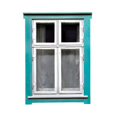 White window with teal frame and curtains.