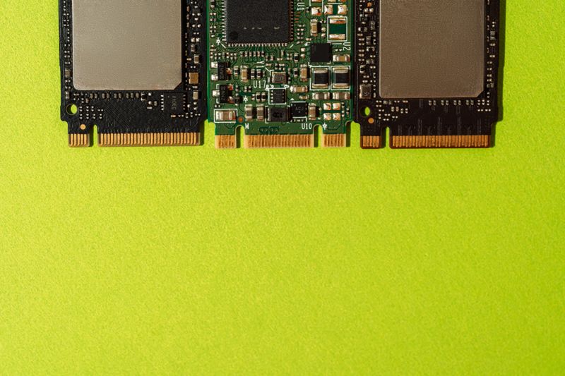 M.2 SSD drives bottom edge aligned on green background with copy space. High quality photo