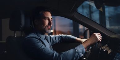 Man driving car at night.