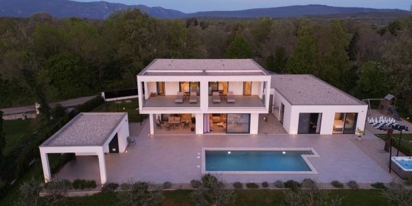 Modern two-story home with pool and outdoor living space.