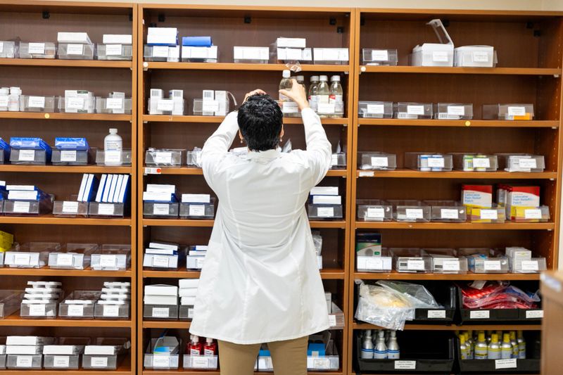 Medical professional working inside a hospital pharmacy