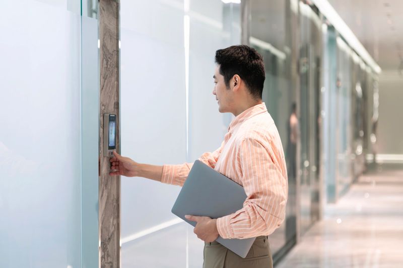 Biometric admittance control device for security system,representing technology in workplace security. Concept mobile access.