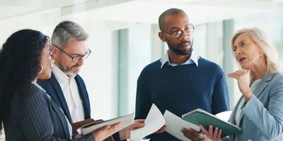 Business planning by four people 