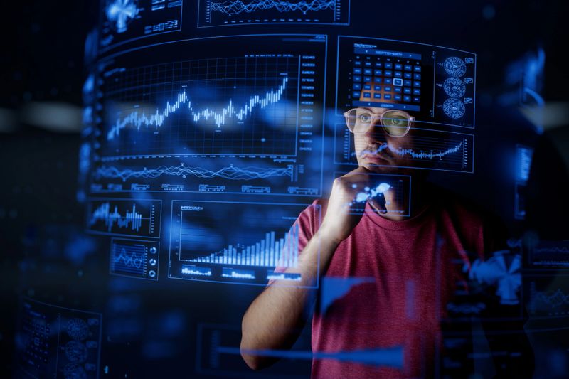 Man look at the dashboard with graphs and charts. Concept of data management system, business intelligence, data statistics, marketing analysis, key performance indicators (KPI) and analytics.