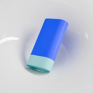 A blue and teal rectangular object on a white surface.