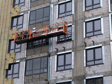 Suspended scaffold platform on a building under construction.
