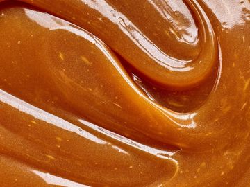Close-up of smooth caramel sauce.